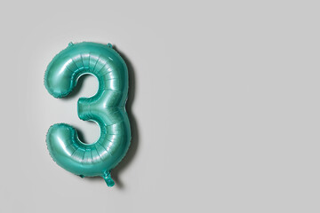Color balloon in shape of figure 3 on light background