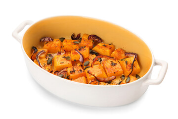 Dish with tasty baked pumpkin pieces on white background