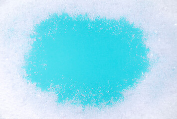 Frozen snow on winter blue background. Minimal winter holidays, New year and Christmas concept. Copy space.