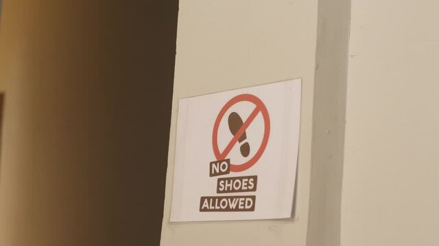 no shoes allow sign in the entrance of a coffee packaging facility.