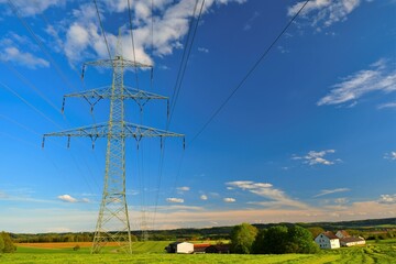 Pylon of the electricity power line on blue sky background.Electricity concept.