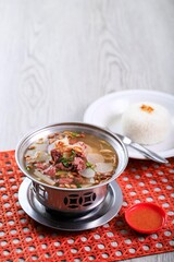 Soto Bandung is a Typical Soto (Traditional Indonesian Soup) from Bandung, West Java. Made from Beef with Addition of Turnips, Tomatoes and Fried Soybeans