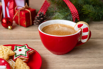 Merry Christmas with homemade cookies and coffee cup on wood table background. Xmas eve, party, holiday and happy New Year concept