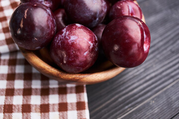 plums fruits natural products on a wooden table top view