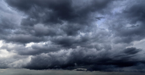 Meteorology Banner Dramatic dark storm clouds black sky background. Dark thunderstorm clouds...