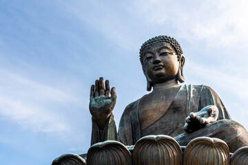 Fototapeta premium Tian Tan Buddha or Giant Buddha statue at Po Lin Monastery of Ngong Ping in Lantau Island, Hong Kong.