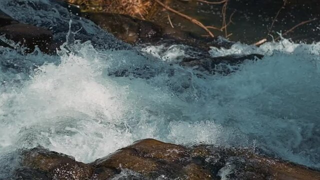 Water falling from the waterfall in slow motion