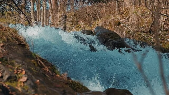 Water falling from the waterfall in slow motion