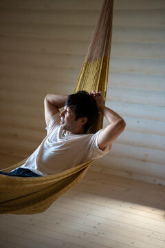 Man Relaxing in Hammock