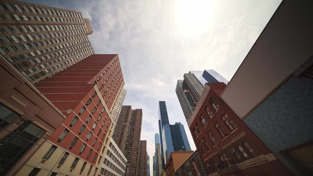 Looking up business and financial skyscraper buildings in NYC. Financial district of New York is an economic business center of America.