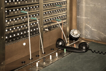 Old vintage telephone switchboard and antique operation workstation close up