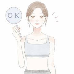 OKサインを出すスポーツウェアを着た女性