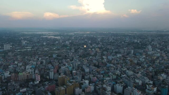 Aerial over the vast conurbation of Dhaka as a thunderstorm approaches