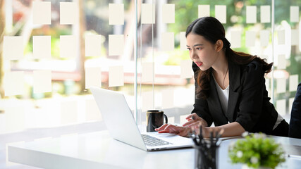 Businesswoman having a online conference meeting via laptop.