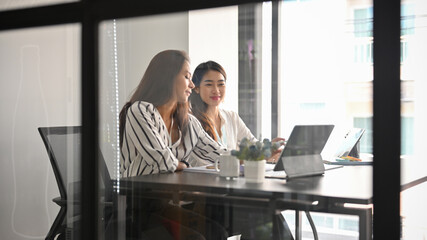 Businesswoman working with her female colleagues.