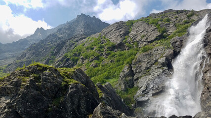 landscape in the mountains and waterfall