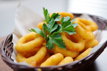 deep fried crispy onion rings squid ring with coriander closeup view