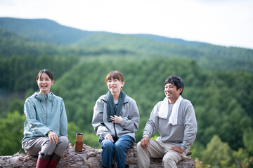 Man and Women Resting on the Top of Mountain