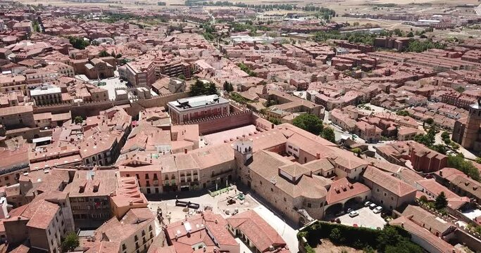 Aerial cityscape of stone defense wall and houses of ancient Avila town in Spain