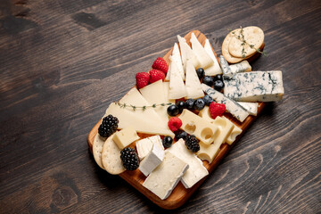 Сheese board with different cheese gorgonzola parmesan brie or camembert and maasdam