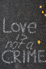 inscription on the pavement love is not a crime