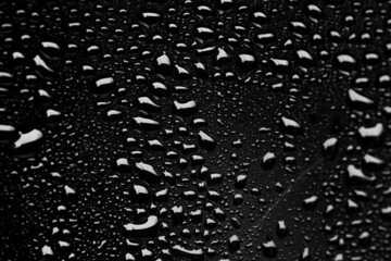 Water drops on black surface