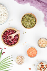 Vegan protein source. Beans, peas, chickpeas, lentils, mung bean, peanut in bowl on white background.