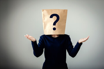 Young woman covered bag her face with question marks icon, Customer confuses, Unclear marketing...