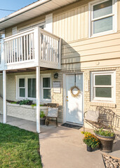 Vertical Traditional two strorey house exterior with balcony