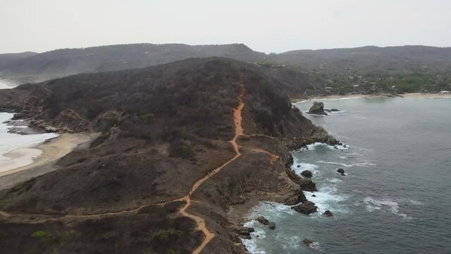Drone view with  pull front above dirt road in Punta Cometa, most west site in Mexico. Mazunte Oaxaca