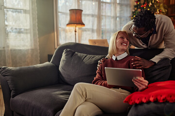 Cozy Christmastime at home for diverse couple