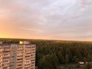 sunset in the city, view from the apartment window