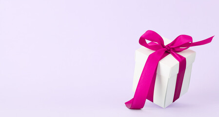 Gift box with red ribbon