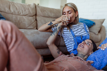 An affectionate lesbian couple at home