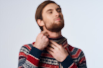 Fototapeta premium sick man in a scarf clings to the neck infection virus light background