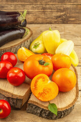 Assortment of fresh vegetables on a wooden background