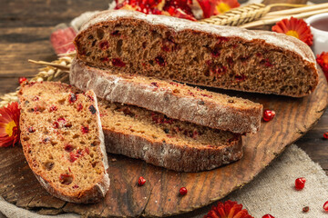 Whole grain bread with cranberry for holidays. Fresh homemade bakery, dry spikelets