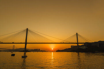 bridge in Hong Kong city under sunset