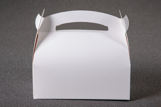 mock up closed white cardboard blank pastry box cake on grey background for cakes and cookies with handle