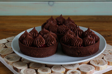 Chocolate brownies with brown cream. Sweet dessert