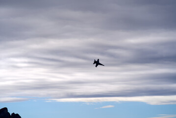 Fighter FA18 Super Hornet at fighter shooting range of Swiss Air Force at Axalp air show on a grey and cloudy autumn afternoon. Photo taken October 19th, 2021, Axalp, Switzerland.