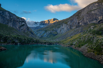 Mountain lake in Pyrenees Lac des Gloriettes during sunrise - France