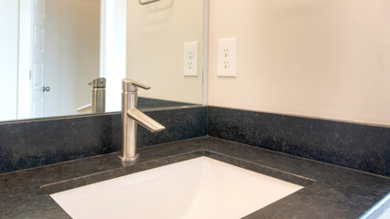 Pano Bathroom sink with granite countertop and single faucet