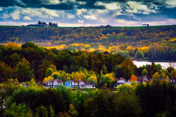 Naklejka premium Autumn landscape with lake and mountains, an overlook of a French center park in the north