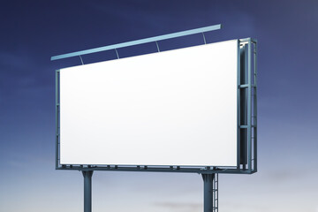 Obraz premium Blank white horizontal billboard on blue sky background at night, perspective view. Mockup, advertising concept