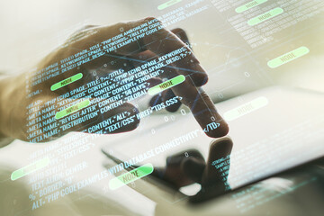 Abstract creative coding concept with finger clicks on a digital tablet on background. Multiexposure