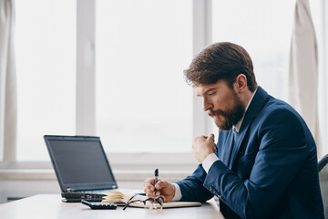 businessmen at the table in front of a laptop communication Professional