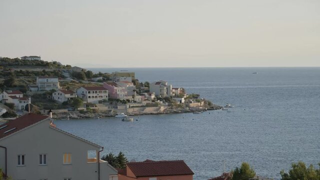 Big cruise ship passing coast town, static.