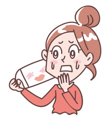 マスクにメイクがついてして悲しむ女性