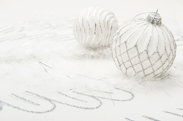 Christmas white background with christmas ball and light glare